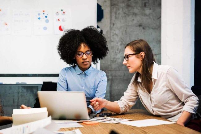 Two women working at a table